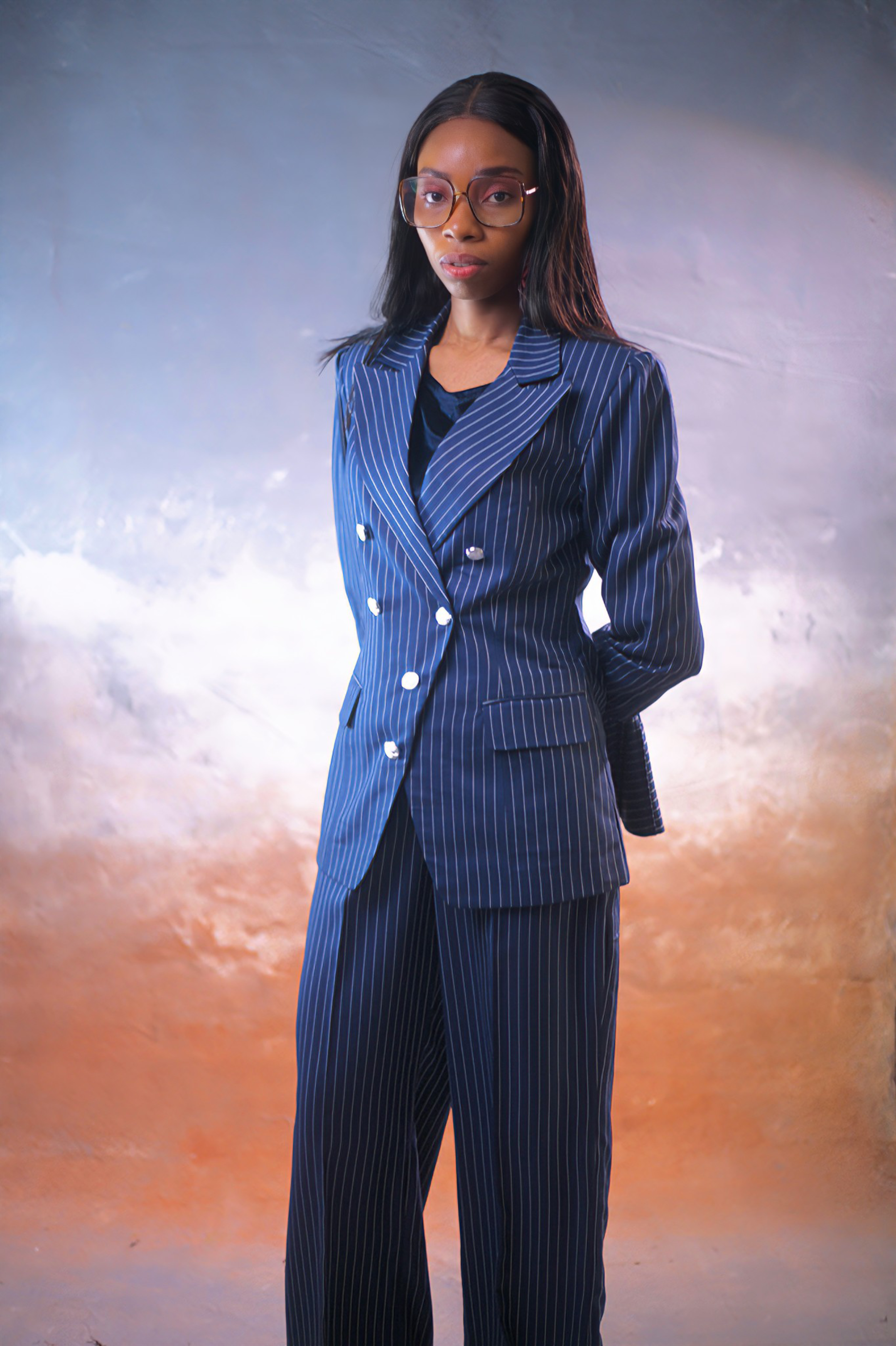 Luxury navy blue pinstripe women’s double-breasted suit with wide-leg tailored trousers